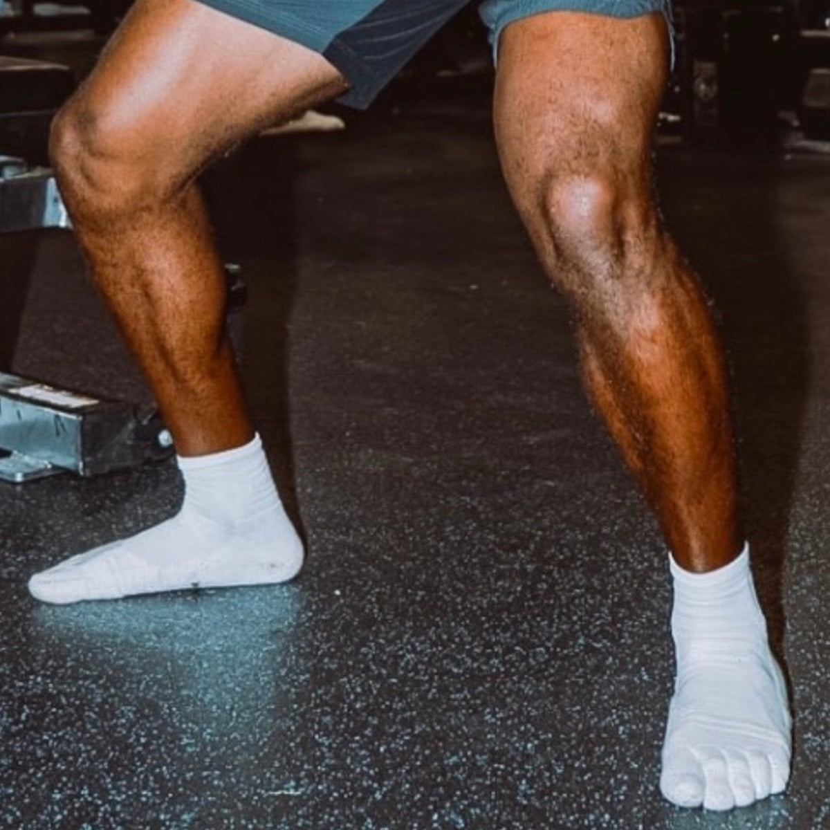 Athlete training in white 1st ERA Performance Toe Socks with five-toe separation for natural toe movement